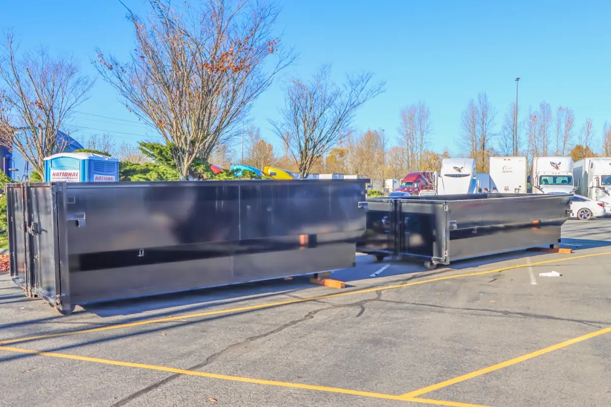 Professional dumpster rental service with roll-off container on residential driveway in Twinsburg